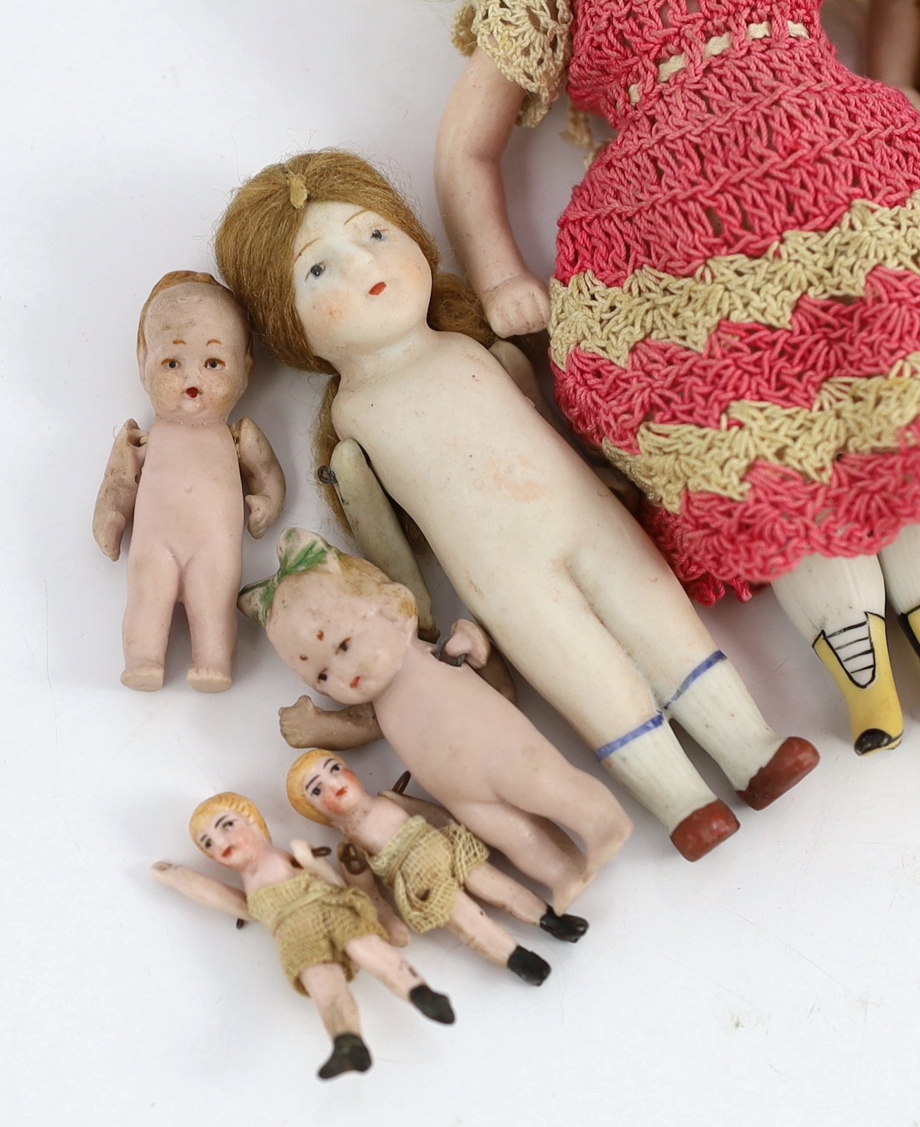 A group of thirteen all-bisque doll’s house dolls, German, early 20th century, tallest 5.5in.